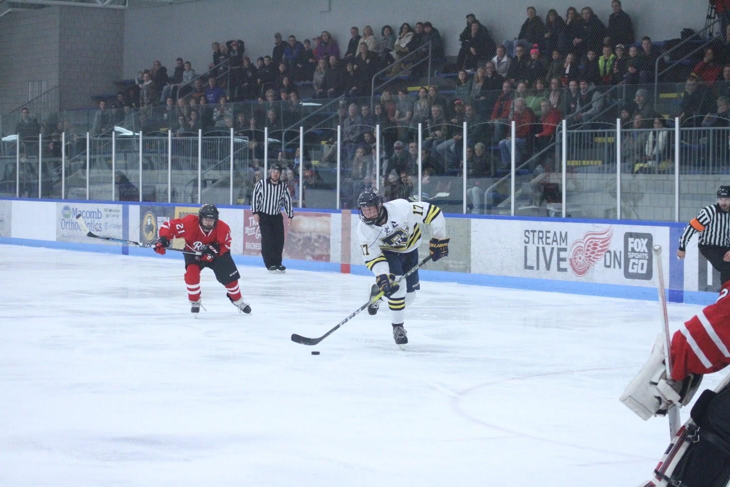 Michael Rittner takes a shot in their game against Romeo High School.