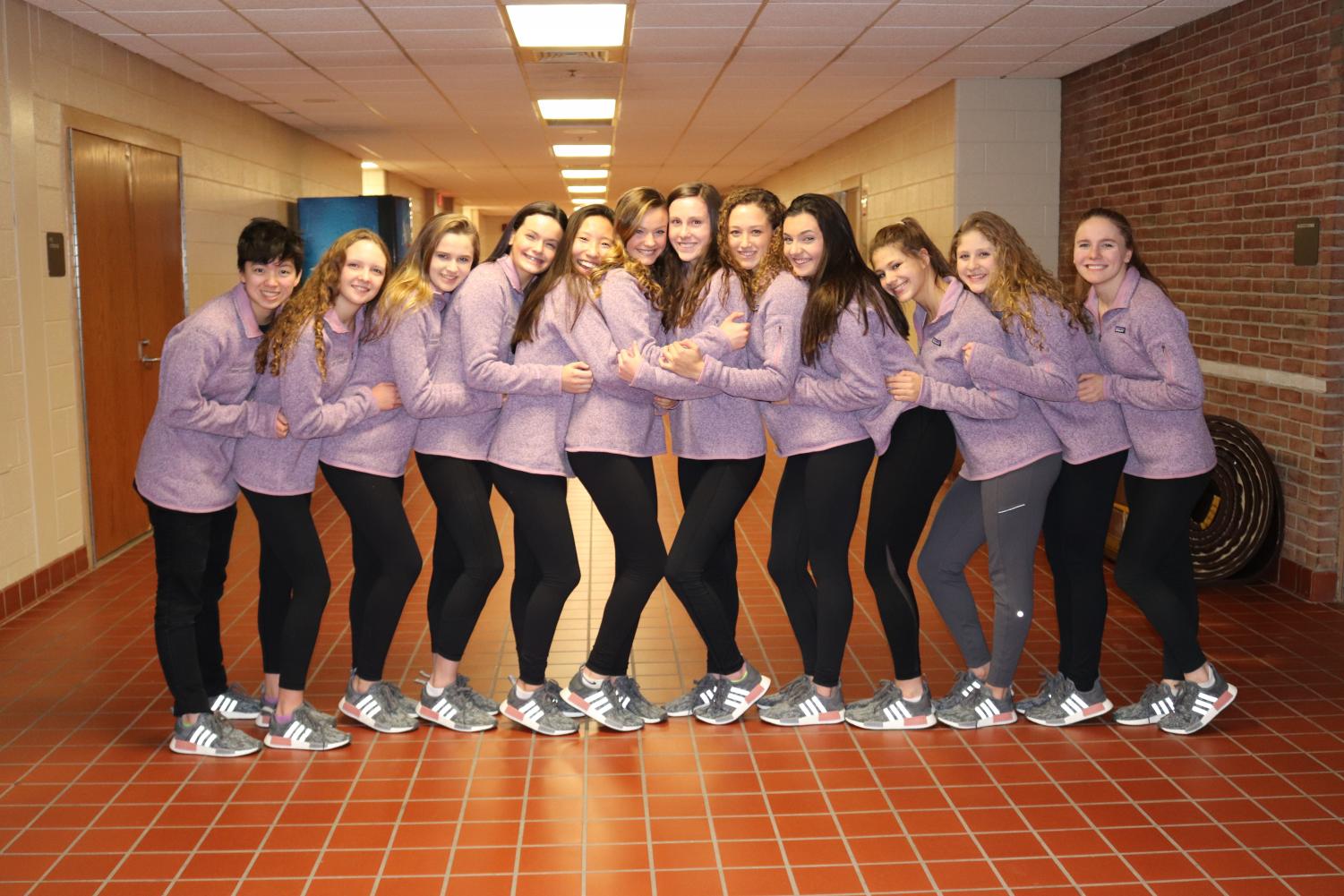 The Adams Varsity Swim and Dive Team at the State finals: Alisa Kong, Allie Danko, Sarah Cole, Meghan Fleury, Wendy Dong, Maddy Fleury, Alex Waack, Grace McGinnis, Reese McCorry, Mackenzie Humphery, Valentina Rengifo, and Lisa Lohner.