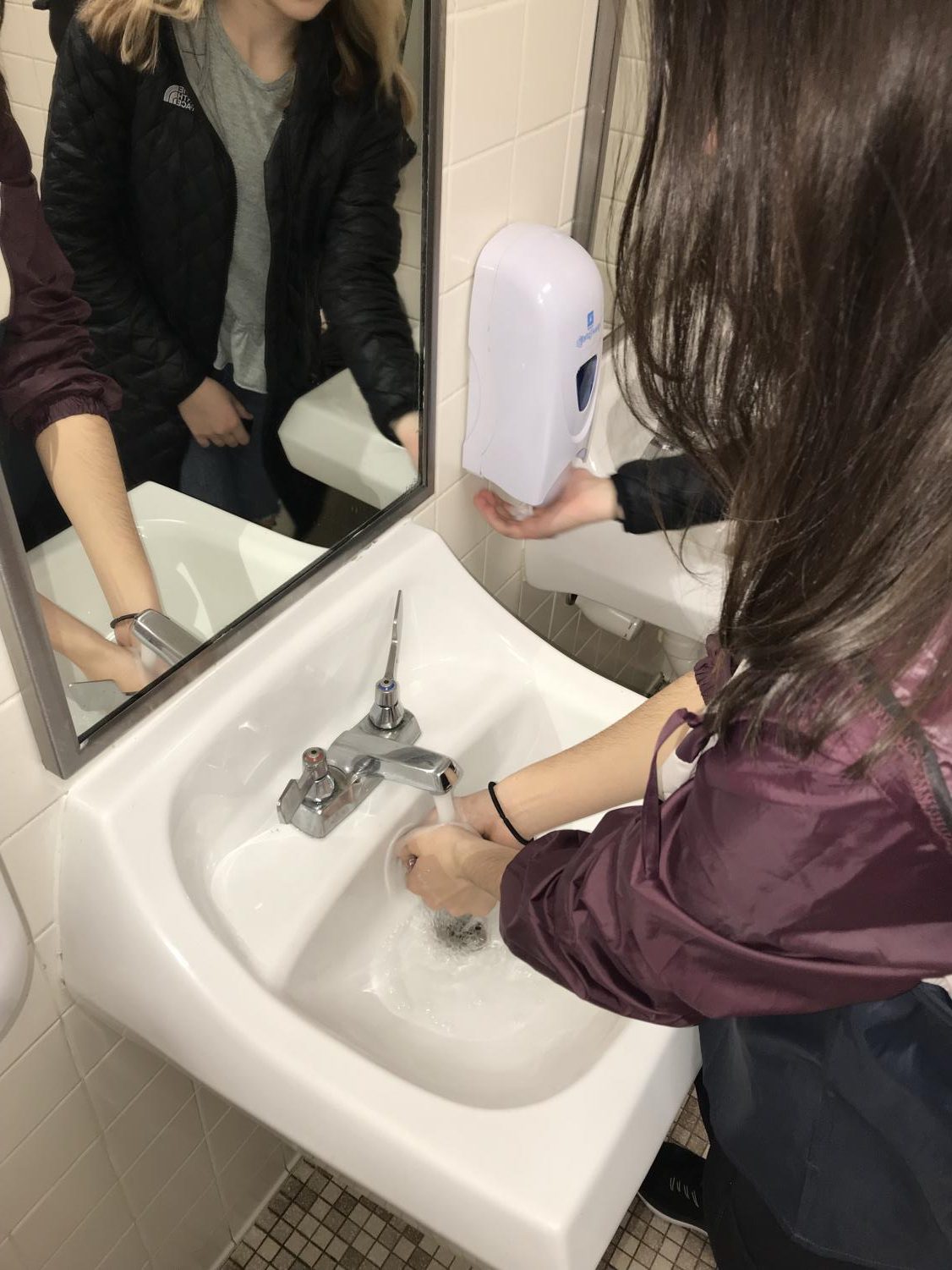 Lexi Borraccio washes her hands. She claims to wash them or use sanitizer more often during the flu season.