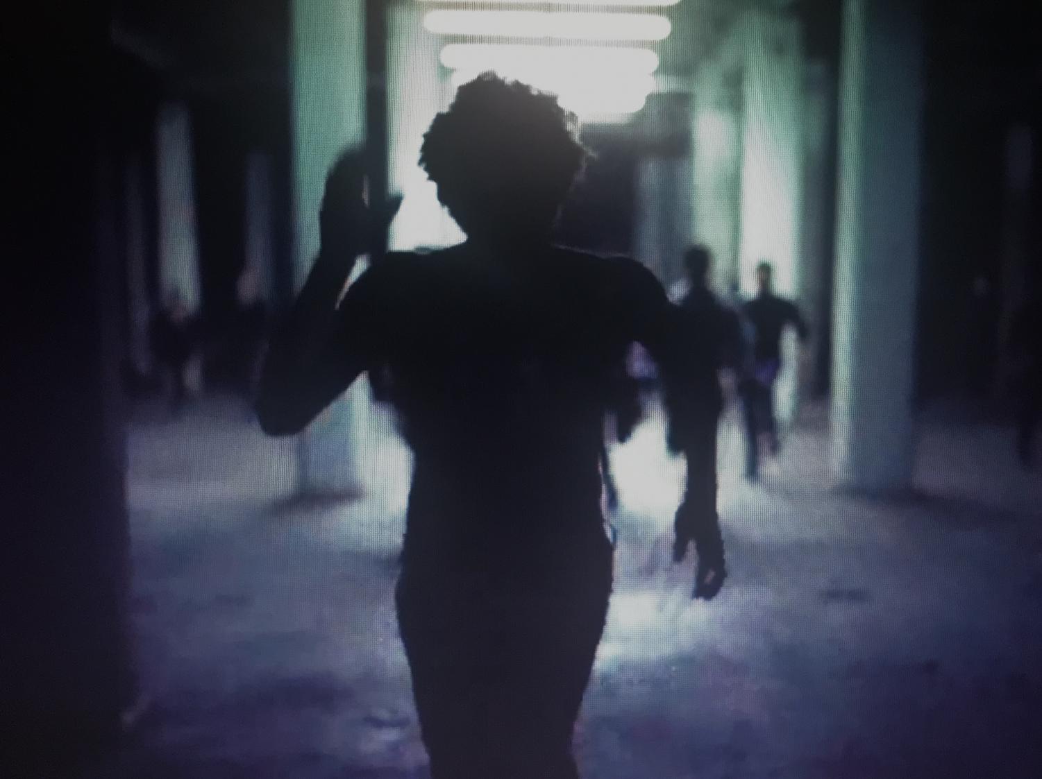 Gambino runs from the police as he embodies an African American facing unreasonable treatment and punishment.