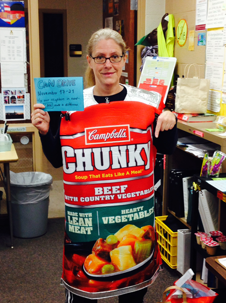 Frau Barner poses as a soup can to promote the canned food drive.