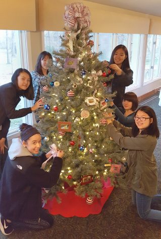 Rochester Adams Art students Nicole Kim, Nikki Ngatio, Samantha Bismack, Jean Cheng, Rebecca Wang, and Maya Yamaguchi helped decorate the tree.   