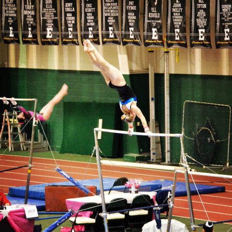 Senior Kate Vibert competing in gymnastics before her ACL injury.