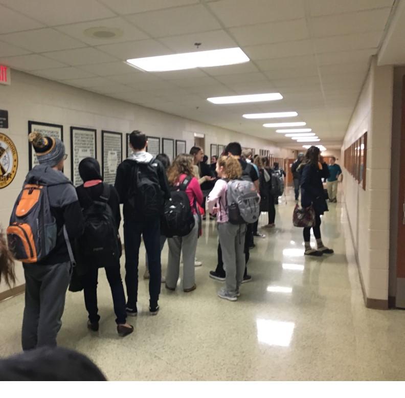 Last Wednesday, students lined up outside the attendance office in order to leave after their two exams. The long line may point to the need to return to the three half-day exam days of the past.