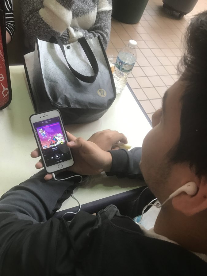 JV Football’s sophomore Kevin Lopez listening to “Stronger” by Kanye West.