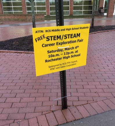 Signs promoting the STEAM Career Exploration Fair are posted around the school.