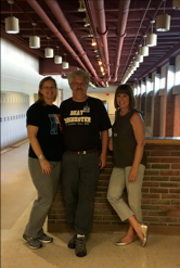 Teachers Mrs. Winkler, Mr. Wieten, and Mrs. Wieten gather for one last group photo before retiring from Rochester Adams High School.