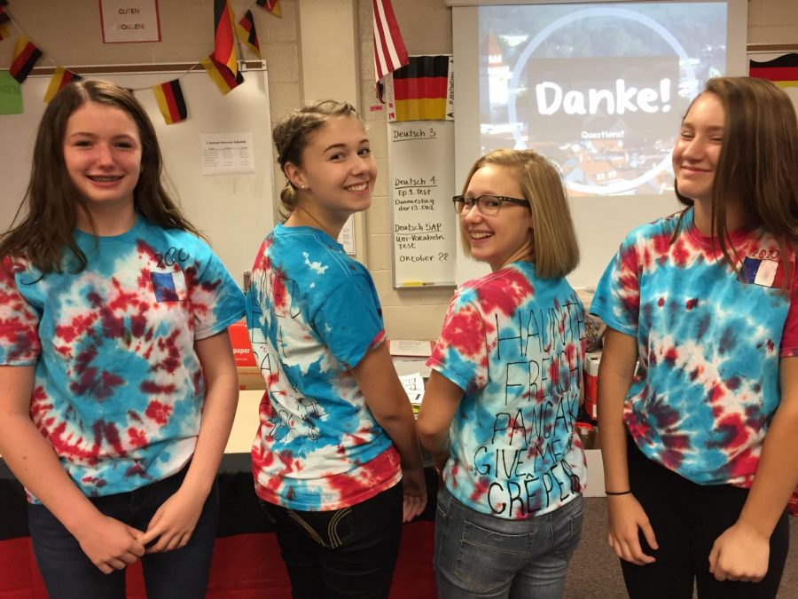 Freshman (from left to right) Quinlyn Jacobs, Keagan Hay, Delaney Marino, and Brynna Garden make matching shirts for Foreign Language Week 2016.