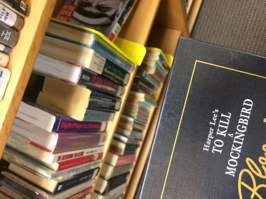 The novel To Kill A Mockingbird is on the shelf of the Adams Library.