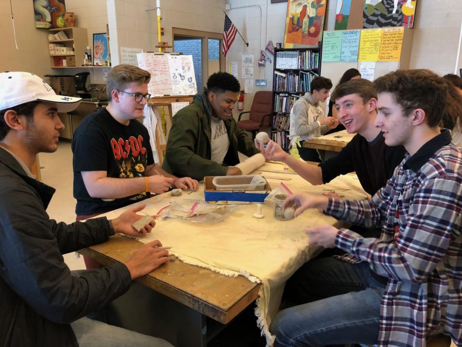 Adams art students working on a ceramics project.