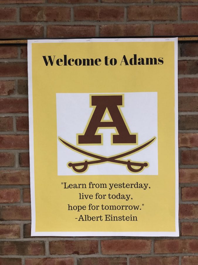 Adams promoting safety in the school hallway.