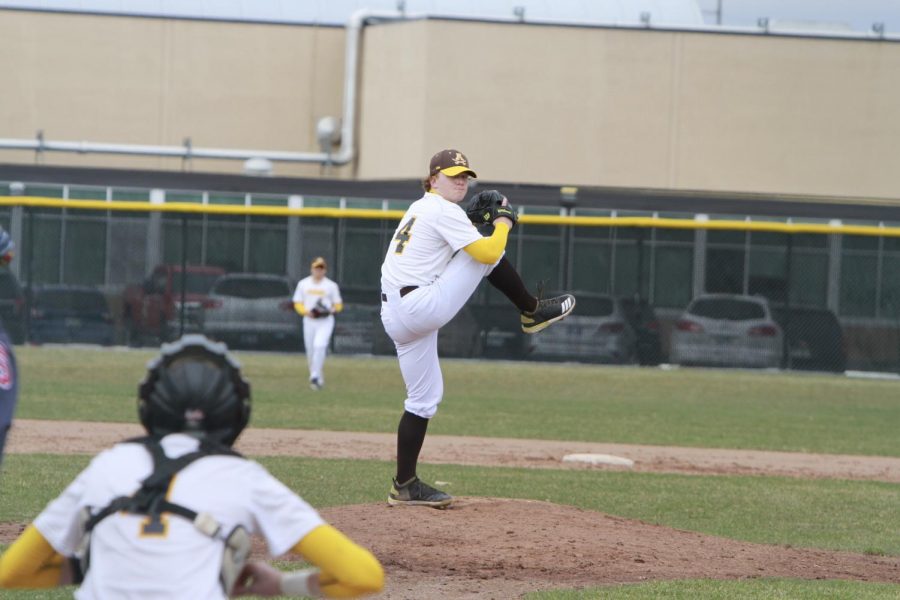 Ben Patton pitching for Rochester Adams.