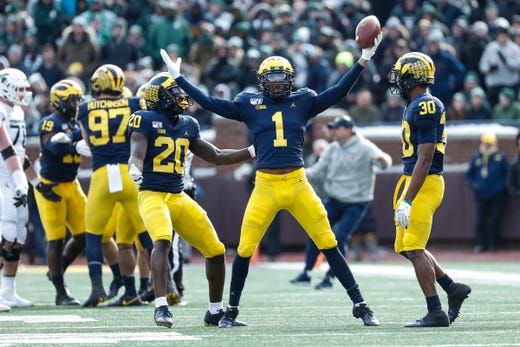 Michigan defensive back Ambry Thomas (1) celebrates his interception against Michigan State during the second half at Michigan Stadium
