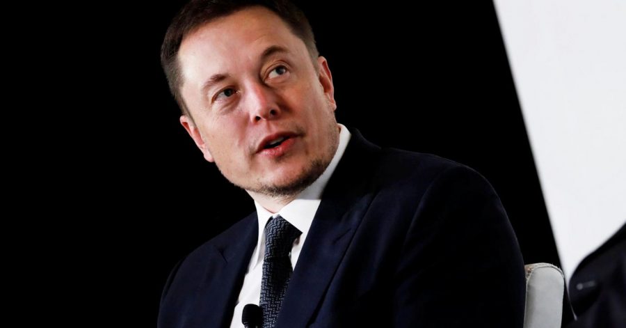 Musk pictured speaking at a conference
