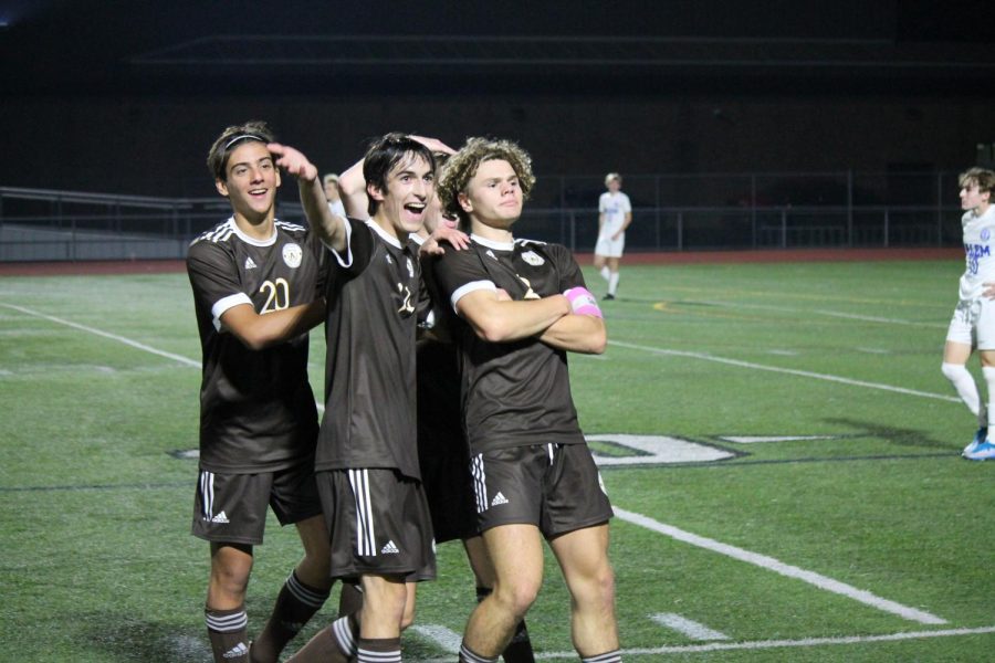 Craft (2) celebrates with his teammates after his second goal in the State Semifinal on Wednesday, November 2, 2022.